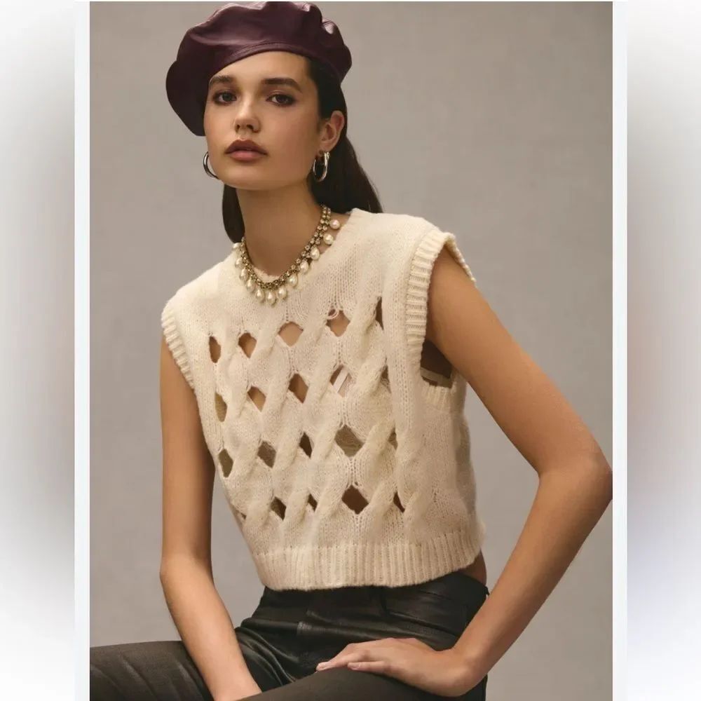 By Anthropologie Cutout Knit Vest Color:
IVORY
Size:
One Size